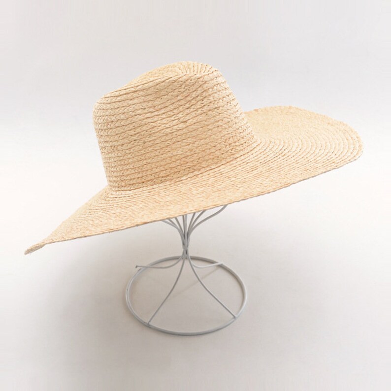 New hollowed-out woven drooping large-brim sisal straw hat outdoor sunshade sun protection beach along the big pot straw hat