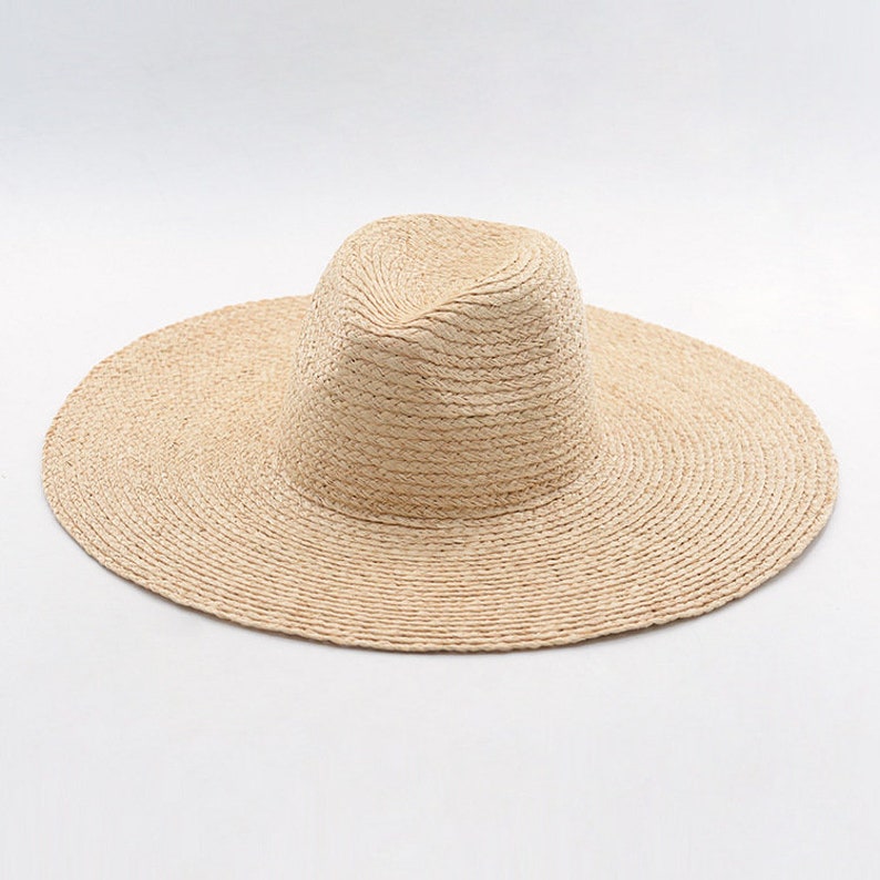 New hollowed-out woven drooping large-brim sisal straw hat outdoor sunshade sun protection beach along the big pot straw hat
