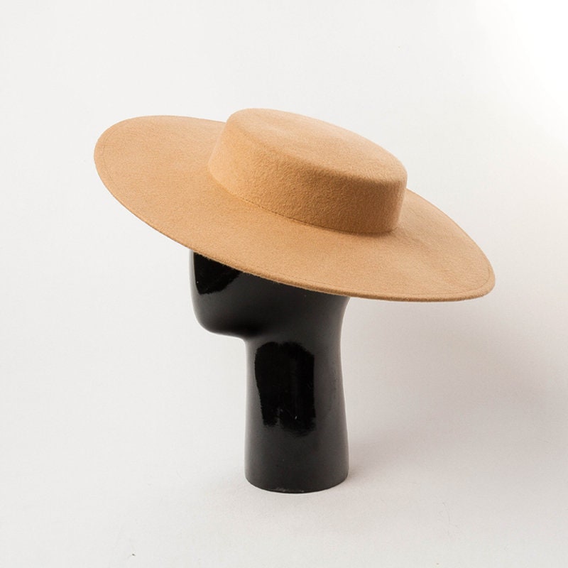 A Woolen Top Hat With a Large Brim and 