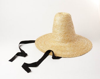 Fashion show modeling straw hat with big brim straw hat with high pointed top and binding band