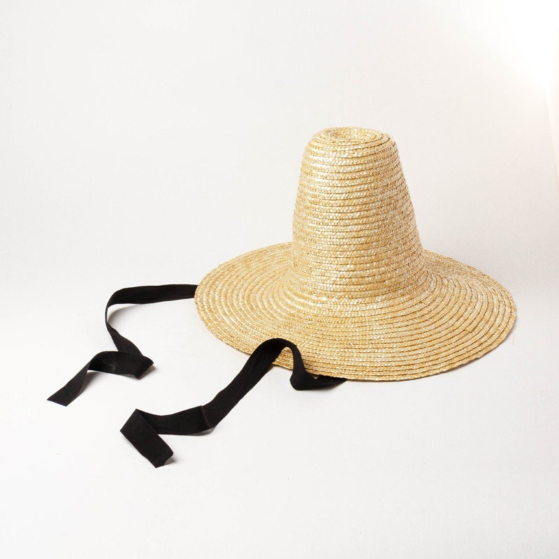 Fashion show modeling straw hat with big brim straw hat with high pointed top and binding band