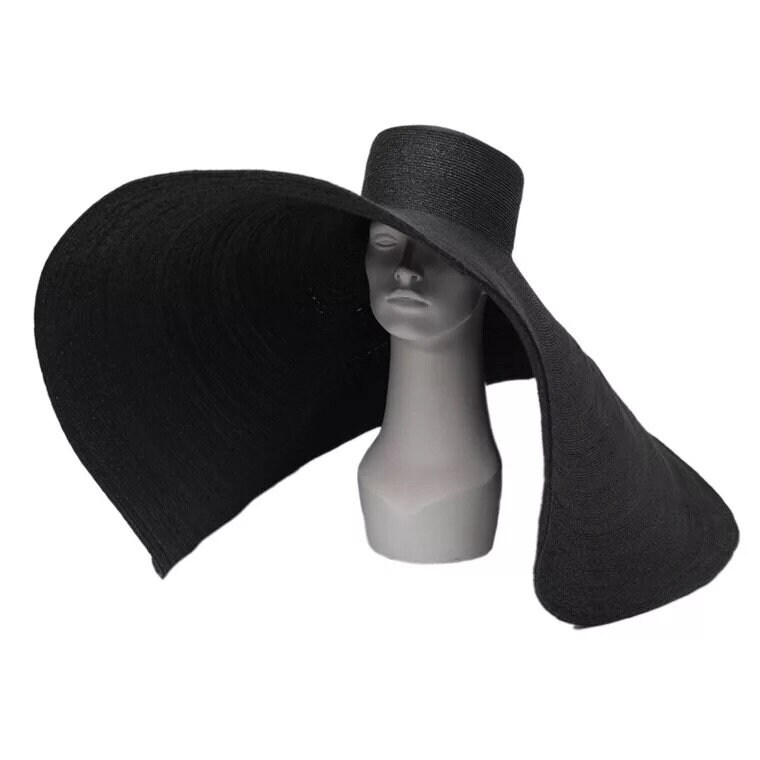 A Straw Straw Hat With Large Oversize 