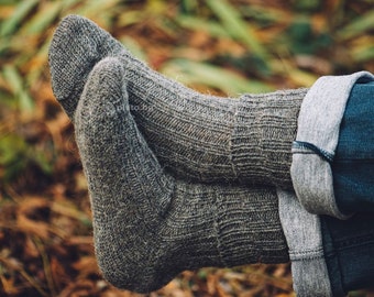 Warm hand-knitted wool socks made from pure sheep's wool in subtle natural colors.