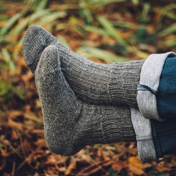 Warm hand-knitted wool socks made from pure sheep's wool in subtle natural colors.