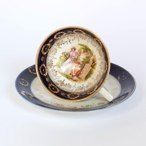 Antique Miniature Footed Cup & Saucer in Cobalt Blue and Gold, with Women Gossiping in a Garden Motif