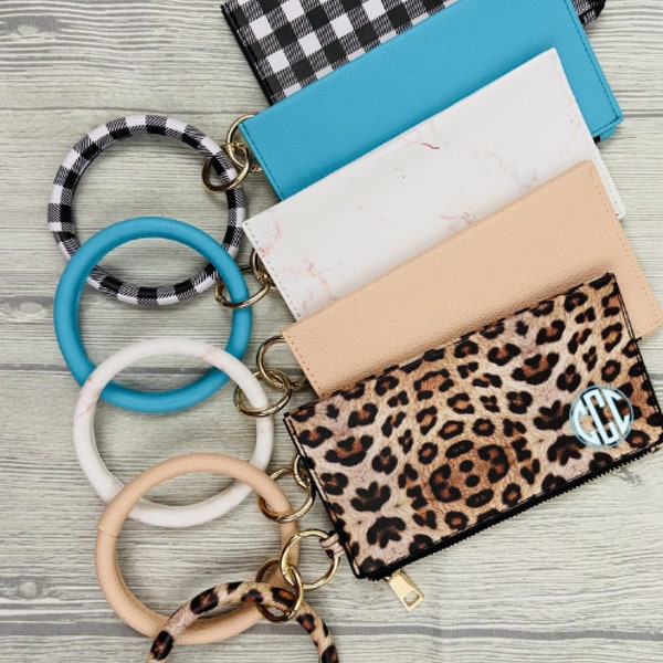 Lost your keys? Forgot your credit card? Keep everything safe and secure while running errands with Mini Wristlet/Clutch and Ring Bangle.