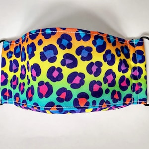 May include: A rainbow leopard print face mask with adjustable black elastic ear loops.