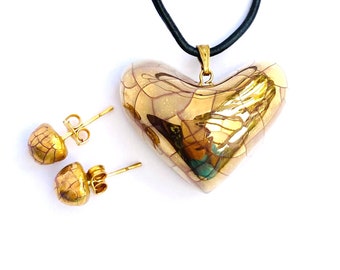 Gold lustre heart pendant set with gold studs. Thoughtful gift for a loved one.