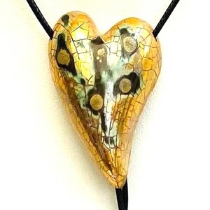 Ceramic heart gold pendant.