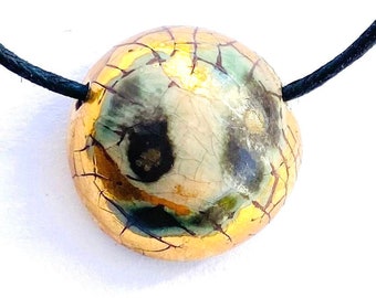 Round raku style pendant with golds, blacks and greens. Perfect gift for men and women.