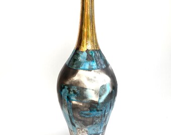 Large bottle shape blue smoke fired ceramic pot. Stunning addition to a classy interior.