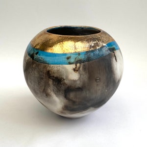 Ceramic smoke-fired vase with blue glaze and gold lustre. Luxury gift for a special occasion.