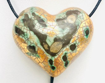 Large gold and black heart porcelain pendant with with an adjustable cotton cord.