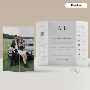 May include: A tri-fold wedding invitation with a black and white design. The front features a photo of a couple in a black car. The invitation includes the couple's names, "Arrabelle and Brandon", the wedding date, "Saturday, the Fifteenth of October Twenty Twenty-Three", and the location, "Four o'clock in the afternoon Church of the Wysteria Linda Street & Seventh Avenue, Carmel, California". The back of the invitation includes a schedule of events for the wedding day.