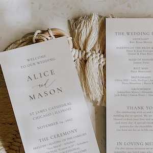 May include: Wedding invitation with the names "Alice and Mason" in elegant script. The invitation includes details such as the date, location in Chicago, and the ceremony schedule. The design is minimalist with a neutral color palette.