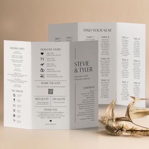 May include: A wedding seating chart with a gray and white color scheme. The chart is titled "Find Your Seat" and lists tables with guest names. The chart is decorated with a floral design.