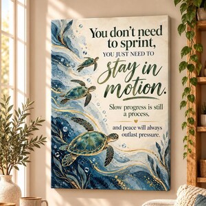 May include: A rectangular wall art print featuring three sea turtles swimming in blue and gold swirling water. The text reads: You don't need to sprint, YOU JUST NEED TO stay in motion. Slow progress is still a process, and peace will always outlast pressure.