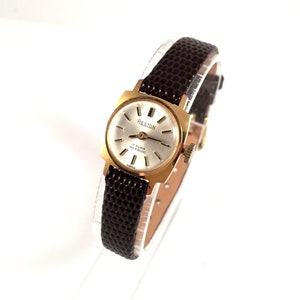 RARE Vintage Swiss lady watch called RESTON. Made in Swiss, vintage women watch, rare dial and case, leather strap.