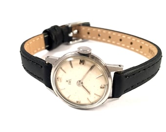 RARE Vintage Swiss lady watch called EBEL. Made in Swiss, petite women watch, classic dial and round case, leather strap.