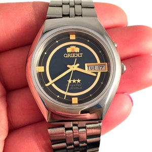 RARE Vintage men's wristwatch called "ORIENT". An Automatic movement gent's watch, comes with new leather band!
