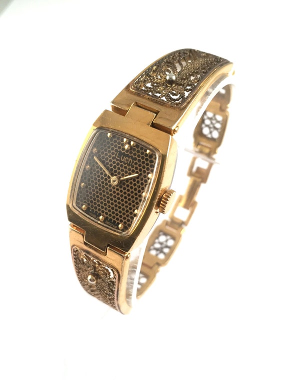 Reloj con brazalete chapado en oro, Oro
