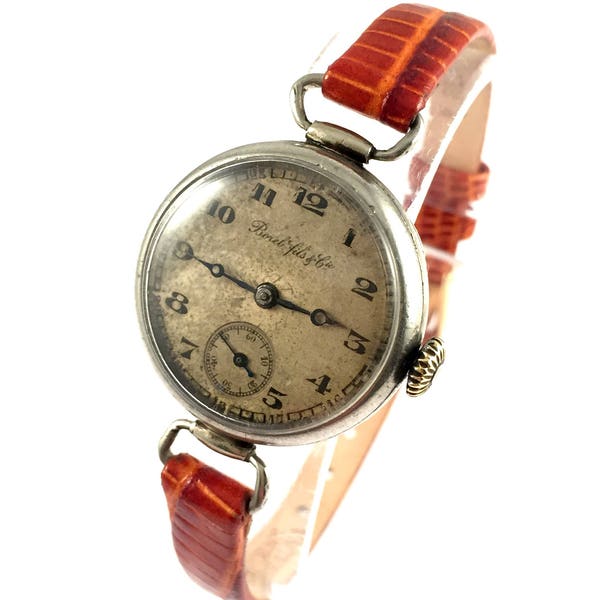 RARE solid silver ANTIQUE women's wristwatch called " Borel Fils and Cie". RARE timepiece with unique lugs and strap.
