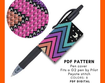 May include: A black pen with a colorful beaded pen cover featuring a chevron pattern in shades of pink, purple, blue, and teal. The image includes a circular pattern with the letter "A" repeated. Text on the image reads "PDF PATTERN".