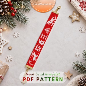 May include: A red seed bead bracelet featuring a white pixelated Christmas pattern including a sleigh, a tree, the text HO HO, a Santa hat, a gift, a reindeer, and a candy cane. The bracelet has gold-toned metal end caps and a lobster clasp.