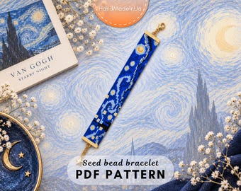 May include: A rectangular seed bead bracelet featuring a blue, yellow, and white pattern inspired by Van Gogh's Starry Night. The bracelet has gold-toned metal end bars and a small gold star charm attached to one end with a lobster claw clasp.