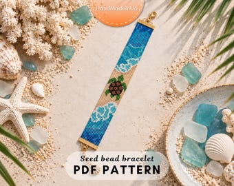 May include: A rectangular seed bead bracelet featuring a central sea turtle motif on a sandy beige background, flanked by blue and white wave patterns. The bracelet has gold-toned metal end caps and a lobster clasp closure at one end.