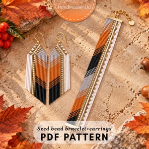 May include: A pair of long, triangular seed bead earrings and a matching flat seed bead bracelet featuring a geometric pattern in orange, black, gray, and white. The jewelry set includes gold-toned metal findings and a lobster clasp closure.
