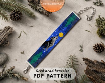 May include: A rectangular seed bead bracelet featuring a pixelated design of a grey wolf howling at a yellow moon against a dark blue night sky with green forest silhouettes. The bracelet includes a silver-toned metal chain and a lobster clasp.
