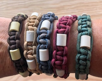 EM anti tick bracelet for humans, a natural alternative to protect against ticks, made with ceramic beads and Portuguese cork cord.