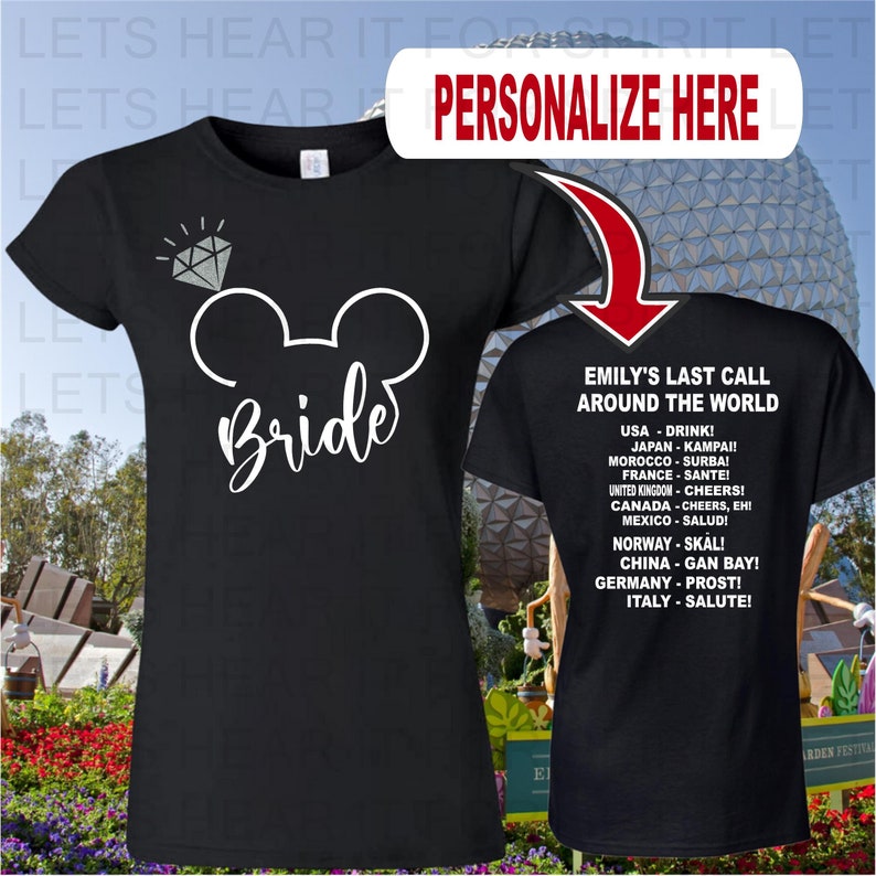 May include: Black t-shirt with a white Mickey Mouse ears design and the word "Bride" written in white script. The back of the shirt has white text that says "Emily's Last Call Around the World" and lists different countries with their respective cheers.