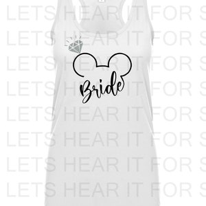 May include: White tank top with a black Mickey Mouse head and the word "Bride" written underneath. A diamond is above the Mickey Mouse head.