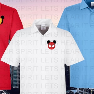 May include: Three white polo shirts with different cartoon character logos on the left chest. The logos are Iron Man, Spider-Man, and Captain America. The shirts are all white with a blue collar and a blue button.
