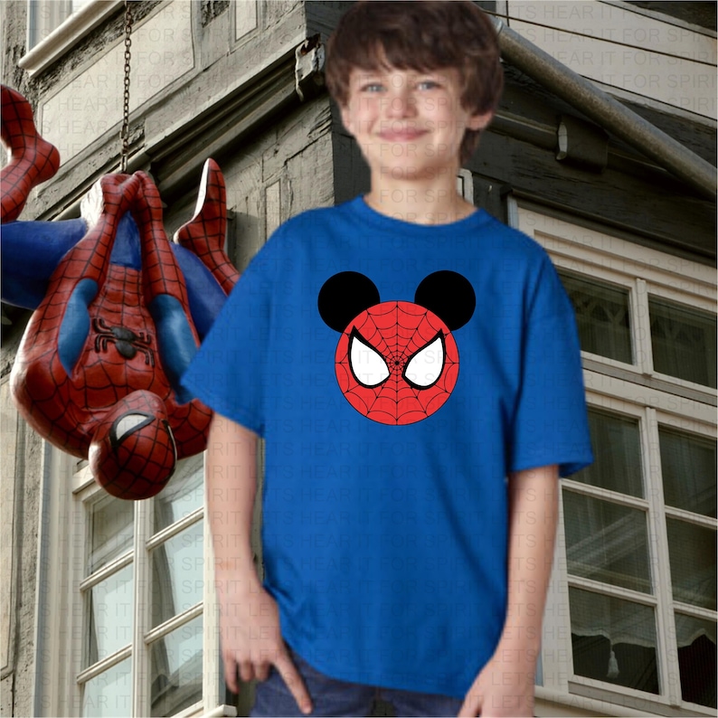 May include: A blue t-shirt with a red and white Spider-Man face with Mickey Mouse ears on it.
