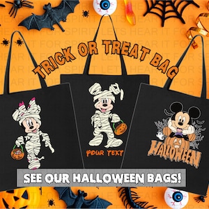 May include: Three black tote bags featuring Halloween-themed graphics. The left bag shows a mummy character holding a pumpkin bucket. The center bag displays a mummy character with space for text. The right bag features a character sitting on a pumpkin.