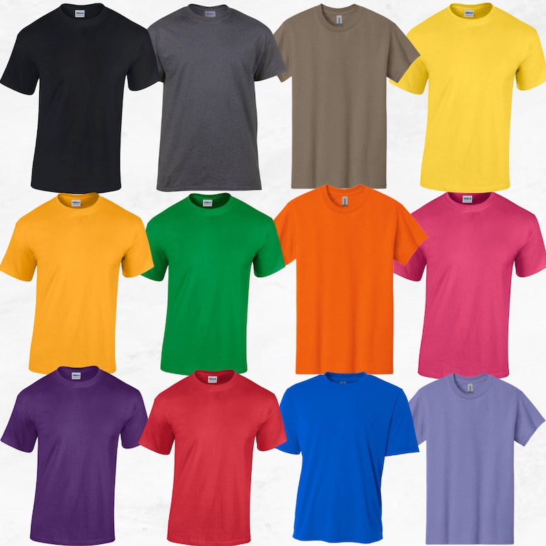 May include: A collection of twelve short-sleeved crew neck t-shirts arranged in a grid. The shirts are displayed in solid colors including black, dark gray, brown, yellow, gold, green, orange, pink, purple, red, blue, and light purple.