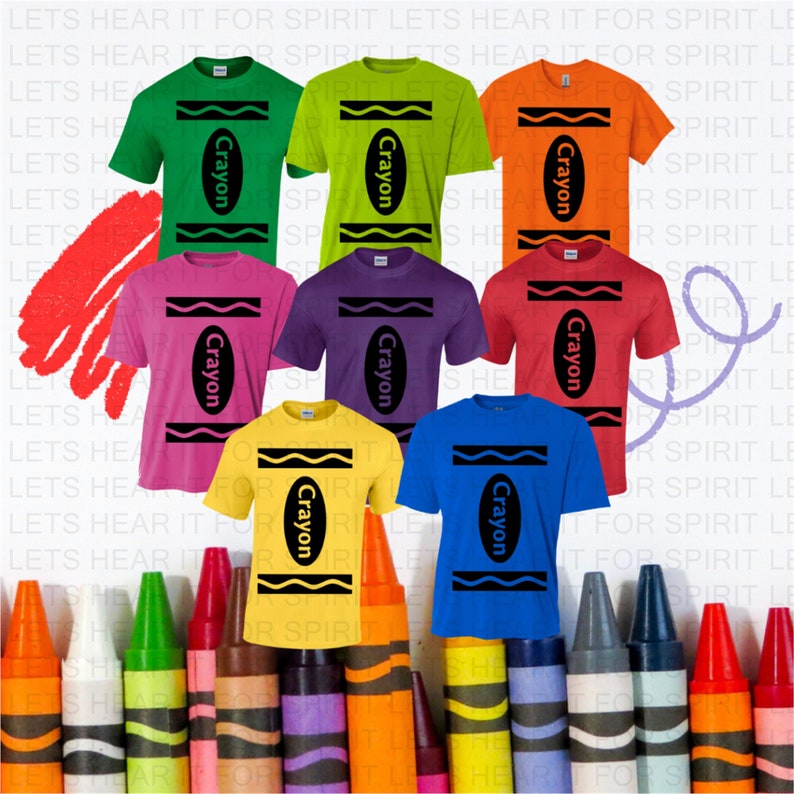 May include: A collection of eight short-sleeve t-shirts in green, lime, orange, pink, purple, red, yellow, and blue. Each shirt features a black graphic design resembling a crayon wrapper with the word Crayon printed in the center.