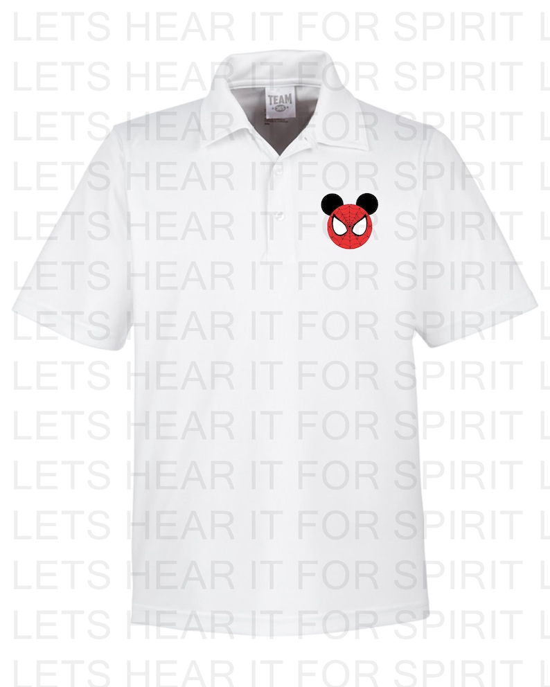 May include: White polo shirt with a red and black Mickey Mouse head with a Spiderman design on the front. The shirt has the text "TEAM" on the left side of the collar.