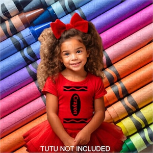 May include: A red short-sleeved shirt featuring a black graphic of a crayon label with the text Crayon in the center. The shirt has a large red bow attached at the neckline. The text TUTU NOT INCLUDED is printed at the bottom of the image.