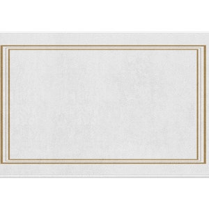 May include: A white bath mat with a double gold border.