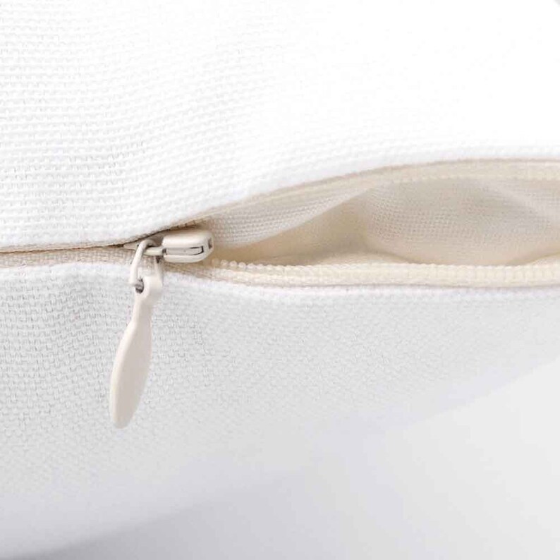 May include: White pillow cover with a zipper closure. The zipper is open and the inside of the pillow cover is visible.