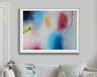 May include: Abstract painting with a white background and splashes of blue, red, orange, and green paint. The painting is framed in a white frame and is hanging on a white wall.
