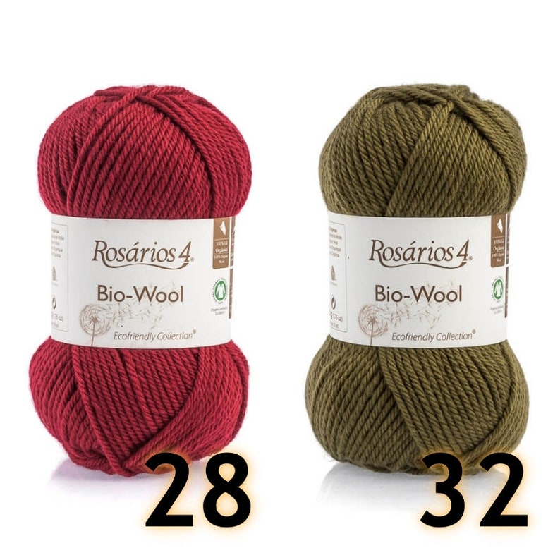 May include: Two skeins of Ros&aacute;rios 4 Bio-Wool yarn, one in deep red and one in olive green. Each skein features a white paper label with the brand name, the text Bio-Wool, and a dandelion graphic. The numbers 28 and 32 are printed below.