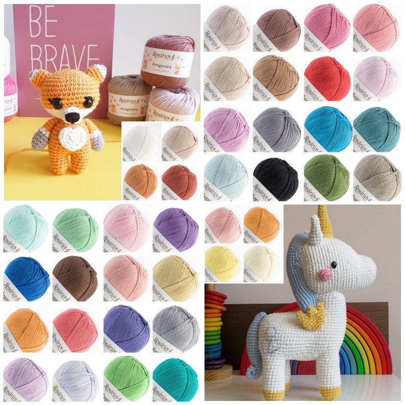May include: A crochet fox and a crochet unicorn amigurumi toy, accompanied by a large collection of various colored yarn balls labeled Ros&aacute;rios 4. The fox is orange and white, while the unicorn is white with a blue mane and yellow horn.