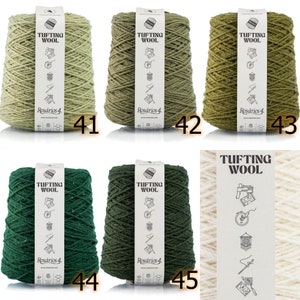 May include: Ten spools of green and cream colored yarn labeled "Tufting Wool" and "Ros&aacute;rios 4".