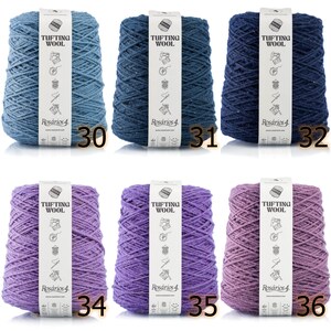 May include: Six spools of yarn in various shades of blue and purple. The yarn is labeled "Tufting Wool" and "Ros&aacute;rios 4".