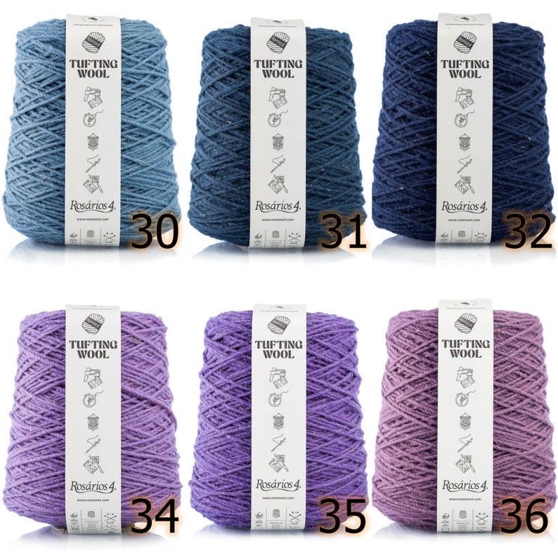 May include: Six spools of yarn in various shades of blue and purple. The yarn is labeled "Tufting Wool" and "Ros&aacute;rios 4".